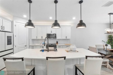 Beautifully upgraded pool home on the golf course. Boasting 4 on Woodmont Country Club in Florida - for sale on GolfHomes.com, golf home, golf lot