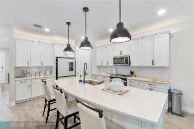 Beautifully upgraded pool home on the golf course. Boasting 4 on Woodmont Country Club in Florida - for sale on GolfHomes.com, golf home, golf lot