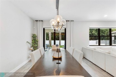 Beautifully upgraded pool home on the golf course. Boasting 4 on Woodmont Country Club in Florida - for sale on GolfHomes.com, golf home, golf lot