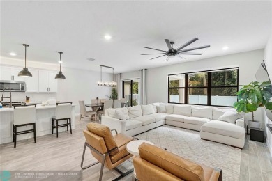 Beautifully upgraded pool home on the golf course. Boasting 4 on Woodmont Country Club in Florida - for sale on GolfHomes.com, golf home, golf lot