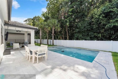 Beautifully upgraded pool home on the golf course. Boasting 4 on Woodmont Country Club in Florida - for sale on GolfHomes.com, golf home, golf lot