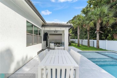 Beautifully upgraded pool home on the golf course. Boasting 4 on Woodmont Country Club in Florida - for sale on GolfHomes.com, golf home, golf lot