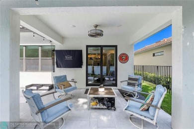 Beautifully upgraded pool home on the golf course. Boasting 4 on Woodmont Country Club in Florida - for sale on GolfHomes.com, golf home, golf lot