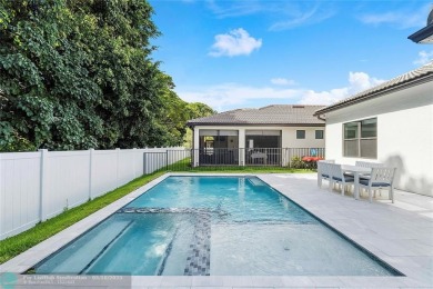 Beautifully upgraded pool home on the golf course. Boasting 4 on Woodmont Country Club in Florida - for sale on GolfHomes.com, golf home, golf lot