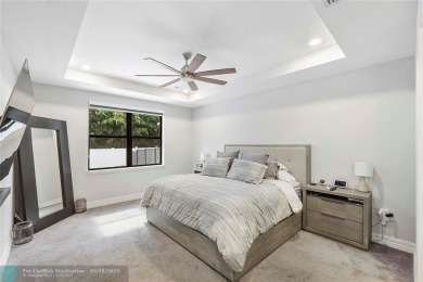 Beautifully upgraded pool home on the golf course. Boasting 4 on Woodmont Country Club in Florida - for sale on GolfHomes.com, golf home, golf lot
