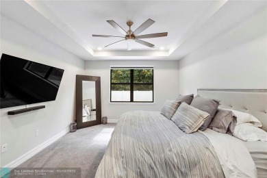 Beautifully upgraded pool home on the golf course. Boasting 4 on Woodmont Country Club in Florida - for sale on GolfHomes.com, golf home, golf lot