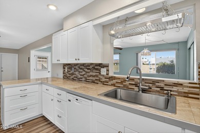 Beautifully updated 3-bedroom, 2-bath home in the heart of Sun on PalmBrook Country Club in Arizona - for sale on GolfHomes.com, golf home, golf lot