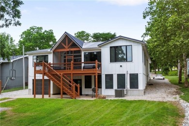ABSOLUTELY GORGEOUS RANCH ON THE LAKE WITH FLOATING DOCK!!! Best on Linn Valley Lakes - Deer Trace Golf Course in Kansas - for sale on GolfHomes.com, golf home, golf lot
