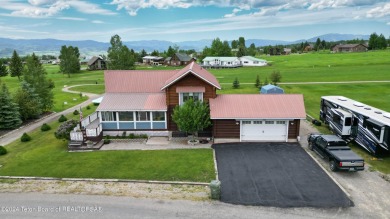 This expansive 5 bed, 3 bath log home offers a perfect blend of on Cedar Creek Golf Course in Wyoming - for sale on GolfHomes.com, golf home, golf lot