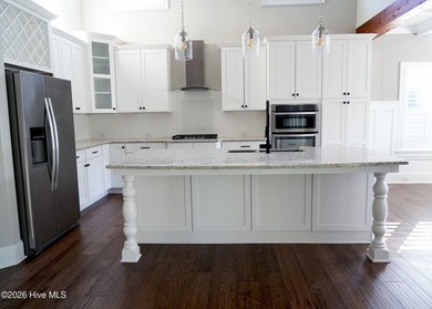 Step inside this luxury coastal craftsman, pristine Riptide home on Sea Trail Golf Resort in North Carolina - for sale on GolfHomes.com, golf home, golf lot