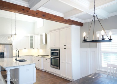 Step inside this luxury coastal craftsman, pristine Riptide home on Sea Trail Golf Resort in North Carolina - for sale on GolfHomes.com, golf home, golf lot