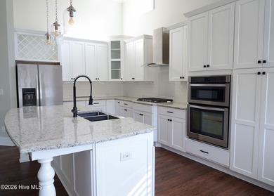 Step inside this luxury coastal craftsman, pristine Riptide home on Sea Trail Golf Resort in North Carolina - for sale on GolfHomes.com, golf home, golf lot