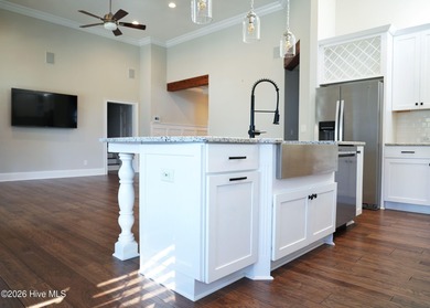 Step inside this luxury coastal craftsman, pristine Riptide home on Sea Trail Golf Resort in North Carolina - for sale on GolfHomes.com, golf home, golf lot