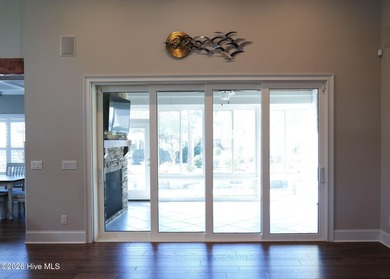 Step inside this luxury coastal craftsman, pristine Riptide home on Sea Trail Golf Resort in North Carolina - for sale on GolfHomes.com, golf home, golf lot