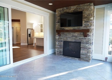 Step inside this luxury coastal craftsman, pristine Riptide home on Sea Trail Golf Resort in North Carolina - for sale on GolfHomes.com, golf home, golf lot