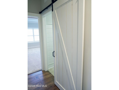 Step inside this luxury coastal craftsman, pristine Riptide home on Sea Trail Golf Resort in North Carolina - for sale on GolfHomes.com, golf home, golf lot