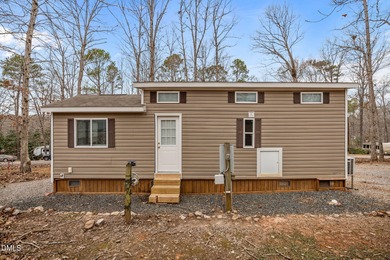 Come see this well-maintained 2017 park model camper located on on River Golf and Country Club at Lake Royale in North Carolina - for sale on GolfHomes.com, golf home, golf lot