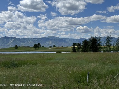 Wonderful home site in Teton Springs backing to a lake.  Imagine on Teton Springs Resort and Club in Idaho - for sale on GolfHomes.com, golf home, golf lot