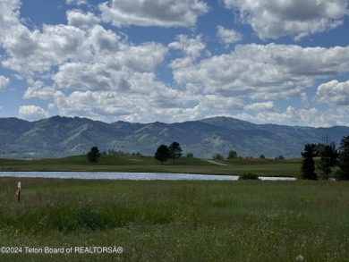 Wonderful home site in Teton Springs backing to a lake.  Imagine on Teton Springs Resort and Club in Idaho - for sale on GolfHomes.com, golf home, golf lot