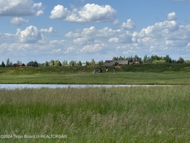 Wonderful home site in Teton Springs backing to a lake.  Imagine on Teton Springs Resort and Club in Idaho - for sale on GolfHomes.com, golf home, golf lot