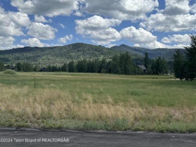 Wonderful home site in Teton Springs backing to a lake.  Imagine on Teton Springs Resort and Club in Idaho - for sale on GolfHomes.com, golf home, golf lot