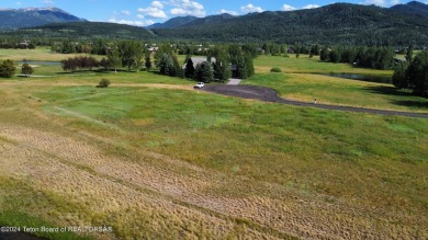 Wonderful home site in Teton Springs backing to a lake.  Imagine on Teton Springs Resort and Club in Idaho - for sale on GolfHomes.com, golf home, golf lot