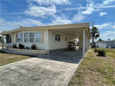 Welcome to your happy new home! This super cute house it sits on on Riverbend Golf and Country Club in Florida - for sale on GolfHomes.com, golf home, golf lot