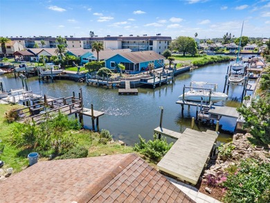 Welcome to 4448 Marine Parkway - Your Waterfront Dream Home on Gulf Harbors Golf Course in Florida - for sale on GolfHomes.com, golf home, golf lot