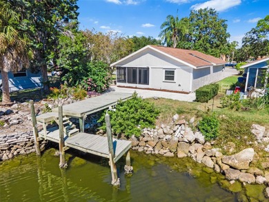 Welcome to 4448 Marine Parkway - Your Waterfront Dream Home on Gulf Harbors Golf Course in Florida - for sale on GolfHomes.com, golf home, golf lot