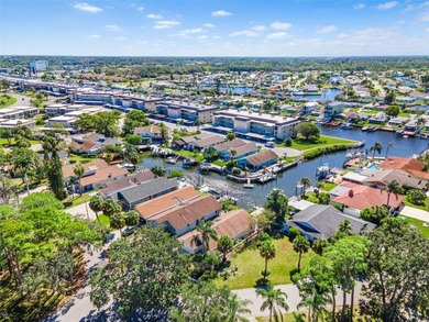Welcome to 4448 Marine Parkway - Your Waterfront Dream Home on Gulf Harbors Golf Course in Florida - for sale on GolfHomes.com, golf home, golf lot