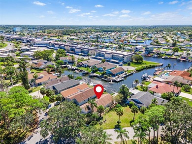 Welcome to 4448 Marine Parkway - Your Waterfront Dream Home on Gulf Harbors Golf Course in Florida - for sale on GolfHomes.com, golf home, golf lot