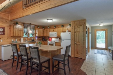 Discover the perfect blend of rustic charm and modern comfort in on Hardwoods Golf Club At Mille Lacs in Minnesota - for sale on GolfHomes.com, golf home, golf lot