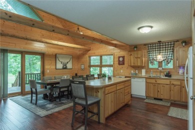 Discover the perfect blend of rustic charm and modern comfort in on Hardwoods Golf Club At Mille Lacs in Minnesota - for sale on GolfHomes.com, golf home, golf lot