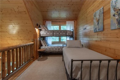 Discover the perfect blend of rustic charm and modern comfort in on Hardwoods Golf Club At Mille Lacs in Minnesota - for sale on GolfHomes.com, golf home, golf lot