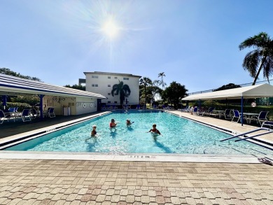 2/2 CONDO NESTLED ON THE WATER WITH LIGHTED FOUNTAIN GOLF VIEWS! on Wynmoor Golf Course in Florida - for sale on GolfHomes.com, golf home, golf lot