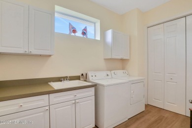 Discover luxury living in this meticulously maintained 3-bedroom on King and Bear Golf Course/World Golf Village in Florida - for sale on GolfHomes.com, golf home, golf lot