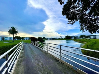 2/2 CONDO NESTLED ON THE WATER WITH LIGHTED FOUNTAIN GOLF VIEWS! on Wynmoor Golf Course in Florida - for sale on GolfHomes.com, golf home, golf lot