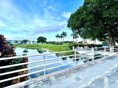 2/2 CONDO NESTLED ON THE WATER WITH LIGHTED FOUNTAIN GOLF VIEWS! on Wynmoor Golf Course in Florida - for sale on GolfHomes.com, golf home, golf lot