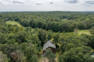 Discover the perfect blend of rustic charm and modern comfort in on Hardwoods Golf Club At Mille Lacs in Minnesota - for sale on GolfHomes.com, golf home, golf lot