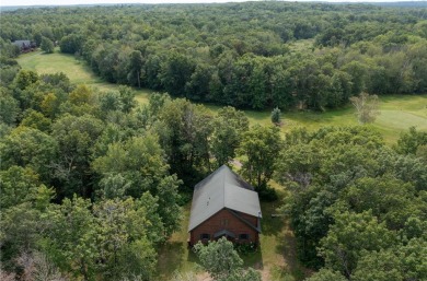 Discover the perfect blend of rustic charm and modern comfort in on Hardwoods Golf Club At Mille Lacs in Minnesota - for sale on GolfHomes.com, golf home, golf lot