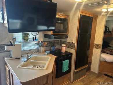 Escape to relaxation with this cozy camper retreat! Nestled in a on River Ridge Golf Club in Virginia - for sale on GolfHomes.com, golf home, golf lot