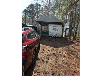Escape to relaxation with this cozy camper retreat! Nestled in a on River Ridge Golf Club in Virginia - for sale on GolfHomes.com, golf home, golf lot