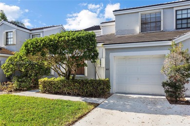 This spacious well maintained 3-bedroom, 2.5-bath townhome with on Woodmont Country Club in Florida - for sale on GolfHomes.com, golf home, golf lot