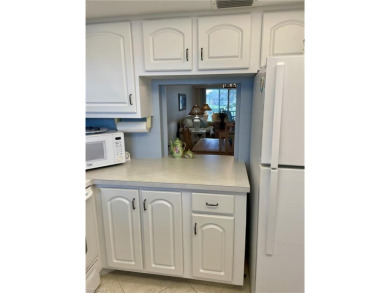 Welcome to this fun, friendly and highly sought after 55+ on Riviera Golf Club in Florida - for sale on GolfHomes.com, golf home, golf lot