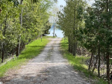 Nicely mature, wooded 1.07 acre lot in a quiet subdivision on A-Ga-Ming Golf Resort in Michigan - for sale on GolfHomes.com, golf home, golf lot