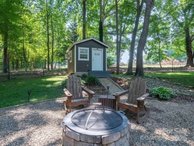 Beautifully updated three-bedroom ranch home nestled at the 14th on Westport Golf Club in North Carolina - for sale on GolfHomes.com, golf home, golf lot