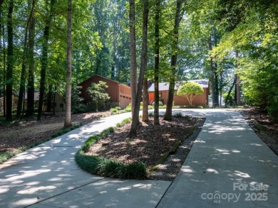 Beautifully updated three-bedroom ranch home nestled at the 14th on Westport Golf Club in North Carolina - for sale on GolfHomes.com, golf home, golf lot