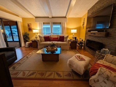 Experience the pinnacle of 55+ living in this impeccably on Grasslands Golf and Country Club in Florida - for sale on GolfHomes.com, golf home, golf lot