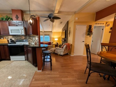 Experience the pinnacle of 55+ living in this impeccably on Grasslands Golf and Country Club in Florida - for sale on GolfHomes.com, golf home, golf lot