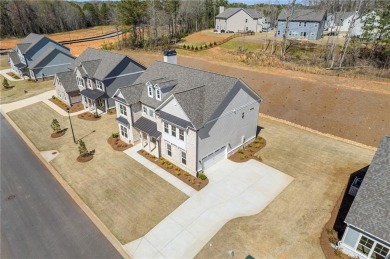 Nestled in the sought-after Traditions of Braselton community on Traditions of Braselton Golf Club in Georgia - for sale on GolfHomes.com, golf home, golf lot
